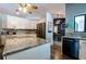 Spacious kitchen with stainless steel appliances, granite countertops, and wood flooring at 8979 Hernando Way, Weeki Wachee, FL 34613