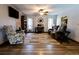 Inviting living room with neutral color scheme, ceiling fan, and a comfortable seating arrangement at 8979 Hernando Way, Weeki Wachee, FL 34613