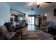 An open living space is filled with natural light and features a kitchen with barstool seating at 8979 Hernando Way, Weeki Wachee, FL 34613
