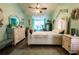 Serene main bedroom with coastal decor, hardwood floors, and elegant furnishings for a relaxing retreat at 8979 Hernando Way, Weeki Wachee, FL 34613