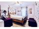 Relaxing bedroom boasts a four-poster bed, neutral decor, and plenty of space to unwind and recharge at 8979 Hernando Way, Weeki Wachee, FL 34613