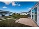 The backyard includes a patio area and well-maintained lawn with a view of the neighborhood at 10022 Lily N St # N, Pinellas Park, FL 33782