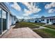 Patio in backyard offers outdoor space, a well-maintained lawn and neighborhood view at 10022 Lily N St # N, Pinellas Park, FL 33782