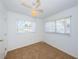 A bright and airy bedroom with natural light, ceiling fan and neutral carpet provides a comfortable space at 10022 Lily N St # N, Pinellas Park, FL 33782