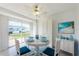 Charming dining area with a round table set for four, complemented by a bright, airy atmosphere at 10022 Lily N St # N, Pinellas Park, FL 33782