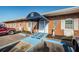 Building entrance featuring a blue awning and a handicap-accessible ramp at 10022 Lily N St # N, Pinellas Park, FL 33782