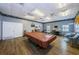 Recreational game room with a pool table, tables, and a selection of board games for leisure and entertainment at 10022 Lily N St # N, Pinellas Park, FL 33782