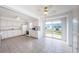 Spacious eat-in kitchen with tile floors, white cabinets, and stainless steel appliances at 10022 Lily N St # N, Pinellas Park, FL 33782