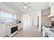 Sunlit kitchen and dining area with sliding glass doors to the backyard, perfect for entertaining at 10022 Lily N St # N, Pinellas Park, FL 33782