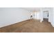 Open living room featuring neutral carpeting and an airy feel, transitioning smoothly into the kitchen and dining areas at 10022 Lily N St # N, Pinellas Park, FL 33782