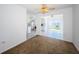 Comfortable living room transitioning to a bright kitchen and dining area, enhancing the open floor plan at 10022 Lily N St # N, Pinellas Park, FL 33782