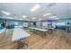 Bright meeting room with ample tables and seating, perfect for community events and gatherings at 10022 Lily N St # N, Pinellas Park, FL 33782