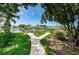 Scenic pond view features lush landscaping and a fountain, creating a peaceful and inviting outdoor space at 10022 Lily N St # N, Pinellas Park, FL 33782