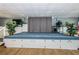 Carpeted stage with storage cabinets, lighting and plant decorations for performances and presentations at 10022 Lily N St # N, Pinellas Park, FL 33782