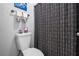 This bathroom features a toilet and patterned shower curtain at 10263 Gandy N Blvd # 209, St Petersburg, FL 33702