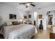 This is a bedroom with a queen size bed, ceiling fan and tile floor at 10263 Gandy N Blvd # 209, St Petersburg, FL 33702