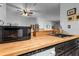 A kitchen offering butcher block countertops, stainless steel appliances, and an efficient layout at 10263 Gandy N Blvd # 209, St Petersburg, FL 33702