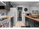 A modern kitchen with black cabinets, stainless steel appliances, and a tile floor for easy maintenance at 10263 Gandy N Blvd # 209, St Petersburg, FL 33702