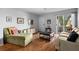 Bright living room with wood floors, comfortable seating, and a sliding glass door leading to the outdoor area at 10263 Gandy N Blvd # 209, St Petersburg, FL 33702