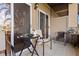 A screened patio featuring neutral colored walls, a tile floor and a dark glass-topped table at 10263 Gandy N Blvd # 209, St Petersburg, FL 33702