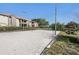 Sandy volleyball court with surrounding green space and nearby buildings at 10263 Gandy N Blvd # 209, St Petersburg, FL 33702