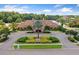Scenic view of the Beach Club with lush landscaping, lake backdrop, and serene atmosphere at 11008 Tahiti Isle Ln, Tampa, FL 33647