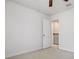 Bedroom with a ceiling fan and door leading to the stairway at 11008 Tahiti Isle Ln, Tampa, FL 33647