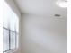 Bright and airy bedroom with a window providing natural light and ventilation at 11008 Tahiti Isle Ln, Tampa, FL 33647