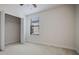 Bedroom with a walk-in closet and window with blinds at 11008 Tahiti Isle Ln, Tampa, FL 33647