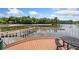 Lakefront view with a dock and seating area; perfect for enjoying waterfront living at 11008 Tahiti Isle Ln, Tampa, FL 33647