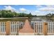 Picturesque dock view on the lake with lush greenery and scenic surroundings at 11008 Tahiti Isle Ln, Tampa, FL 33647