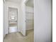 Hallway with a view into a closet and bathroom at 11008 Tahiti Isle Ln, Tampa, FL 33647
