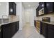 Modern kitchen design featuring stainless steel appliances, granite countertops, and ample cabinet space at 11008 Tahiti Isle Ln, Tampa, FL 33647