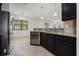 Modern kitchen boasts stainless steel appliances, granite countertops, and pendant lighting at 11008 Tahiti Isle Ln, Tampa, FL 33647