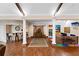 Spacious living area features a wet bar, decorative columns, wood floors, and a colorful play area at 11008 Tahiti Isle Ln, Tampa, FL 33647