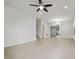 Spacious living room with tiled floors, recessed lighting, ceiling fan, and an open layout leading to other areas at 11008 Tahiti Isle Ln, Tampa, FL 33647