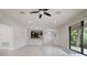 Bright and open living room with tiled flooring, recessed lighting, and sliding door access to the outdoors at 11008 Tahiti Isle Ln, Tampa, FL 33647