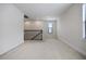 Loft area featuring plush carpeting, natural light, and a decorative staircase railing at 11008 Tahiti Isle Ln, Tampa, FL 33647