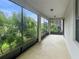 Relaxing screened patio with ample space for outdoor seating and lush greenery at 11008 Tahiti Isle Ln, Tampa, FL 33647