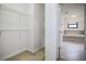 A walk-in closet with shelving and carpeted floor at 11008 Tahiti Isle Ln, Tampa, FL 33647