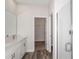 Bathroom features dual sinks, a large mirror and a walk-in shower at 12150 Cattleside Dr, Riverview, FL 33579