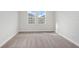 This bedroom features neutral carpet flooring and windows that bring in natural light at 12150 Cattleside Dr, Riverview, FL 33579
