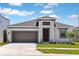 Charming single-story home featuring a two-car garage, well-maintained lawn, and welcoming front entrance at 12150 Cattleside Dr, Riverview, FL 33579