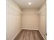 Walk-in closet with carpeted floor and wire shelving at 13008 Wellspring Dr, Lithia, FL 33547