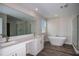 Large bathroom features double vanity, large mirror, soaking tub, and glass shower at 14441 Meadow Bird Ave, Riverview, FL 33579
