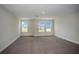 Bedroom with neutral carpet and three bright windows with beautiful views at 14441 Meadow Bird Ave, Riverview, FL 33579