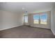 Bedroom with neutral carpet and three bright windows with beautiful views at 14441 Meadow Bird Ave, Riverview, FL 33579