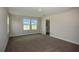 Bedroom with carpet and two bright windows with beautiful views and bathroom at 14441 Meadow Bird Ave, Riverview, FL 33579