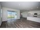 Bright living room with open layout, kitchen view and patio access at 14441 Meadow Bird Ave, Riverview, FL 33579