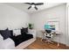 Comfortable bedroom featuring a daybed, wood floors, a ceiling fan, and a window at 15315 Golden Beam Pl, Bradenton, FL 34211
